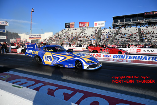 Ron Capps (near lane) vs 
Matt Hagan (far lane)